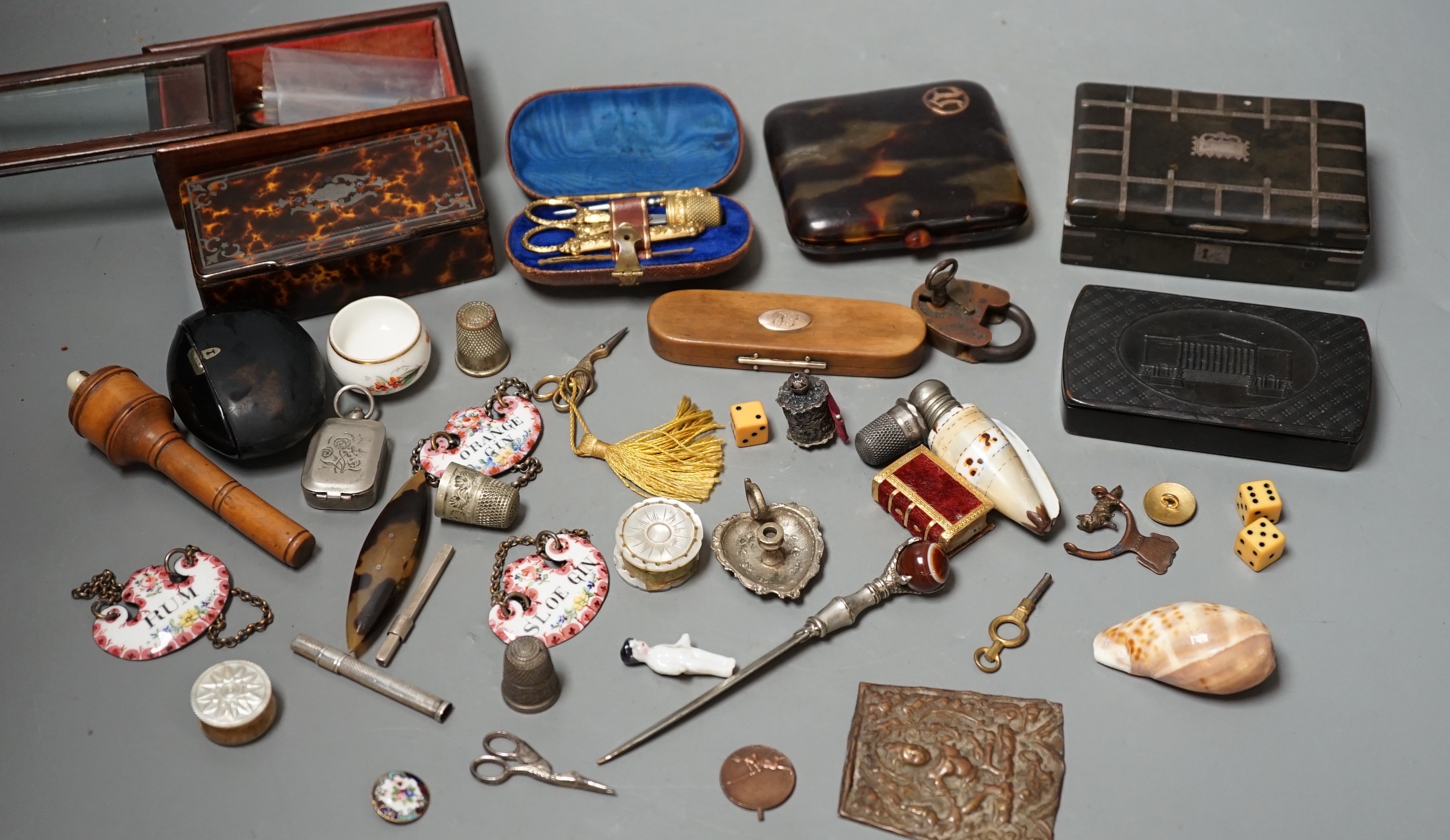 A quantity of various collectables to include a Victorian cased gilt metal etui a 9ct gold mounted boxwood toothpick case, various snuff boxes, miniature penknives, enamelled decanter labels etc.